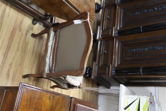 A pair of Louis XV provincial French beech framed fauteuils,